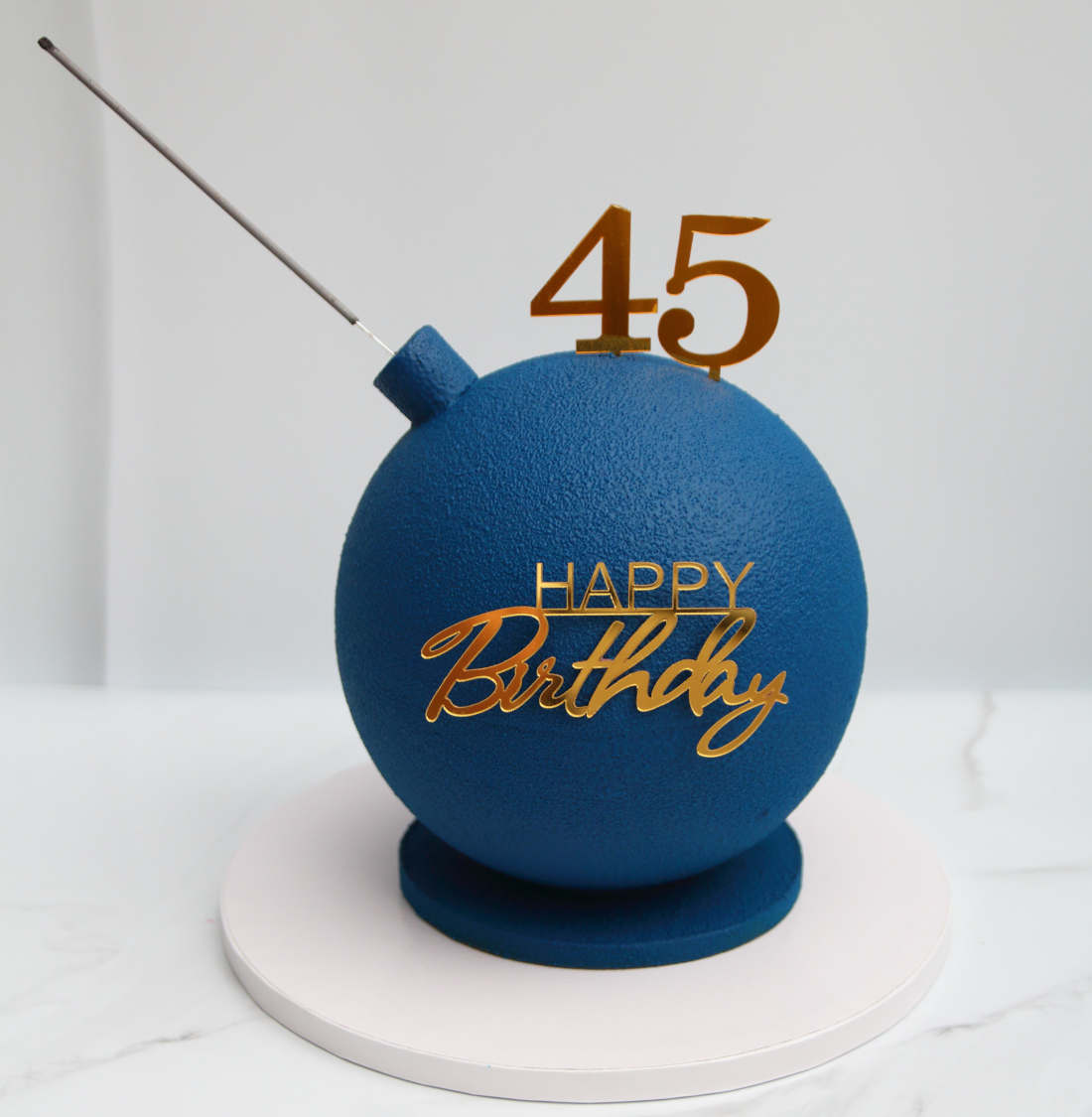 Age on a birthday bomb cake - 45 years old