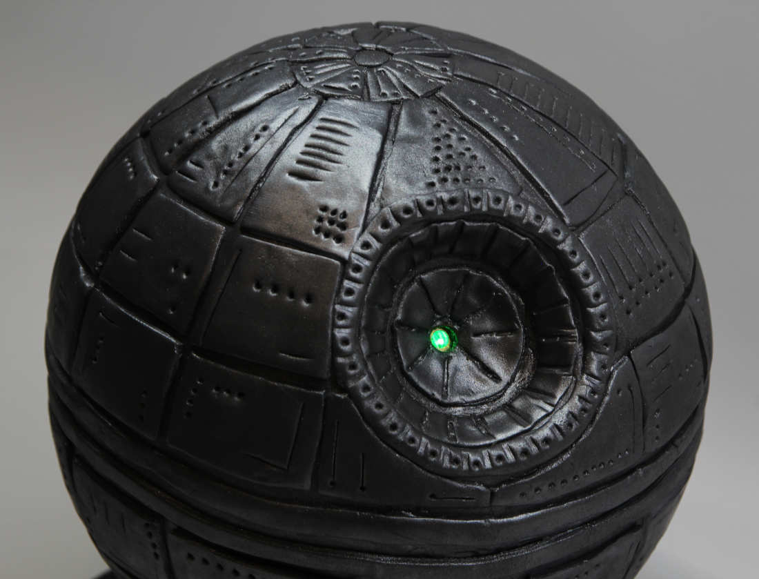 Close-up of the Death Star cake with the laser