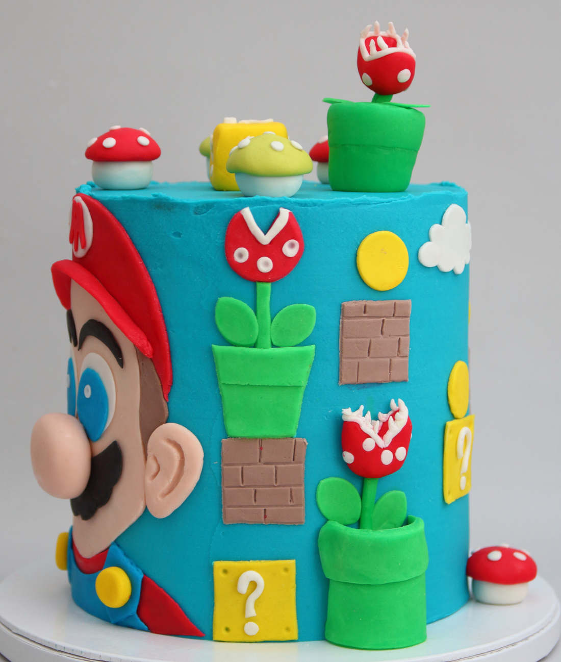Cake with computer and console game Mario