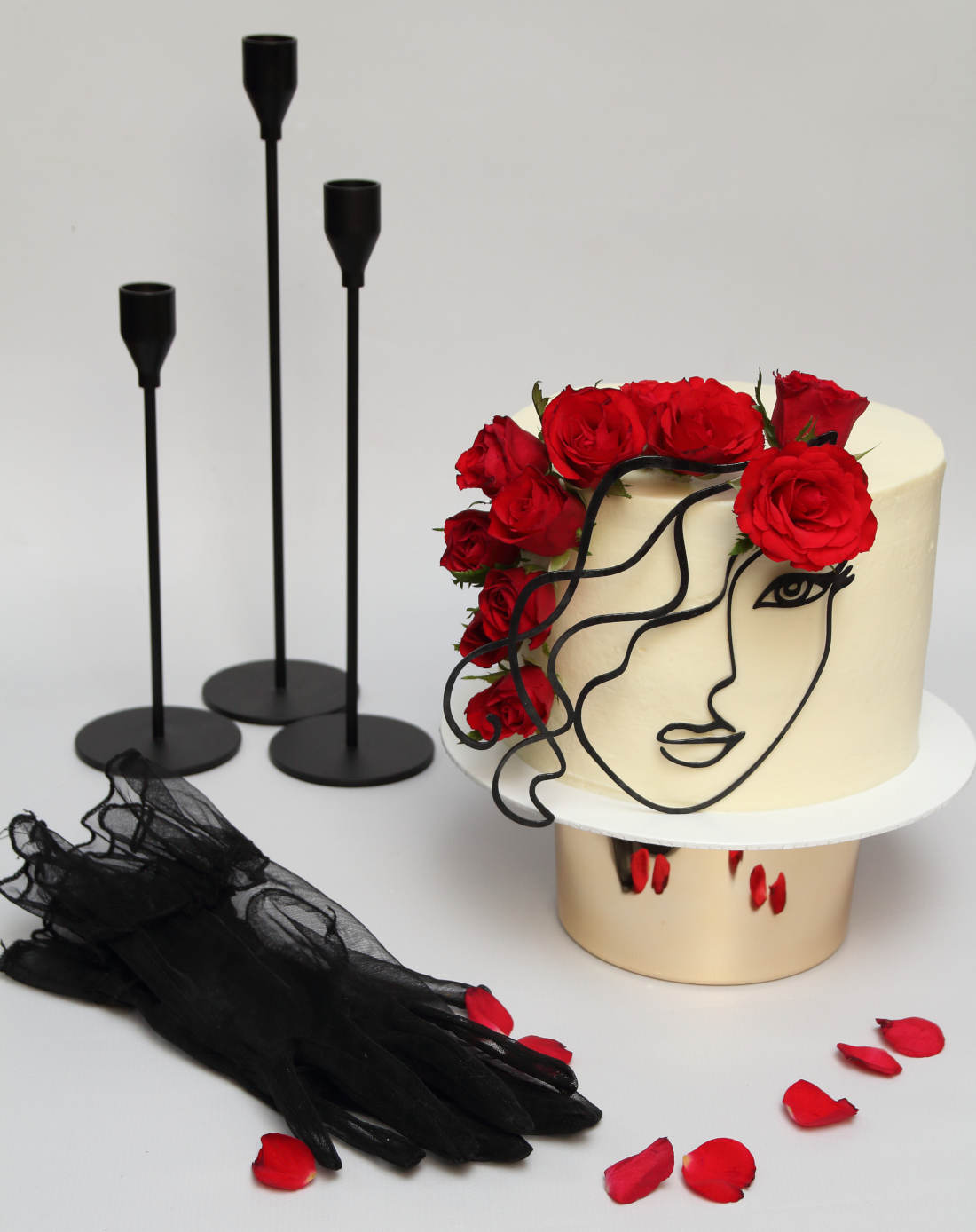 Cake with roses and candlesticks