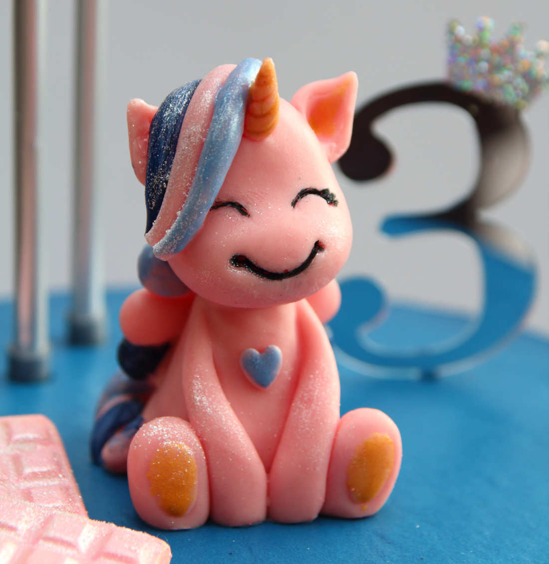 Pink unicorn on a cake for a baby birthday