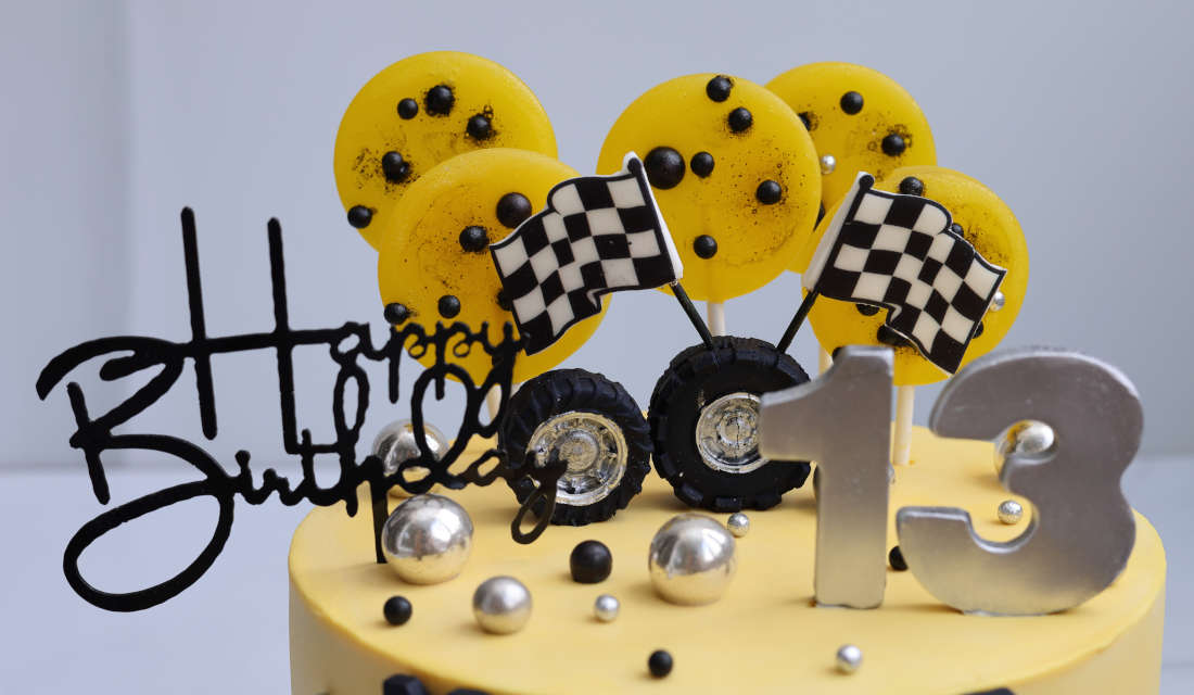 Cake with lollipops and racing flags