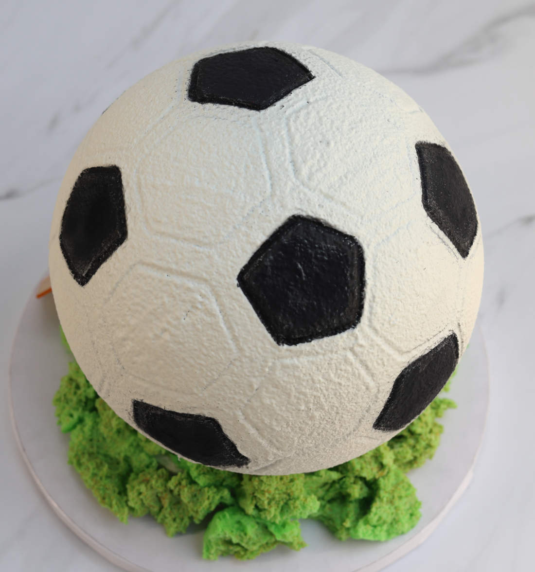 Soccer ball cake for a football player's birthday