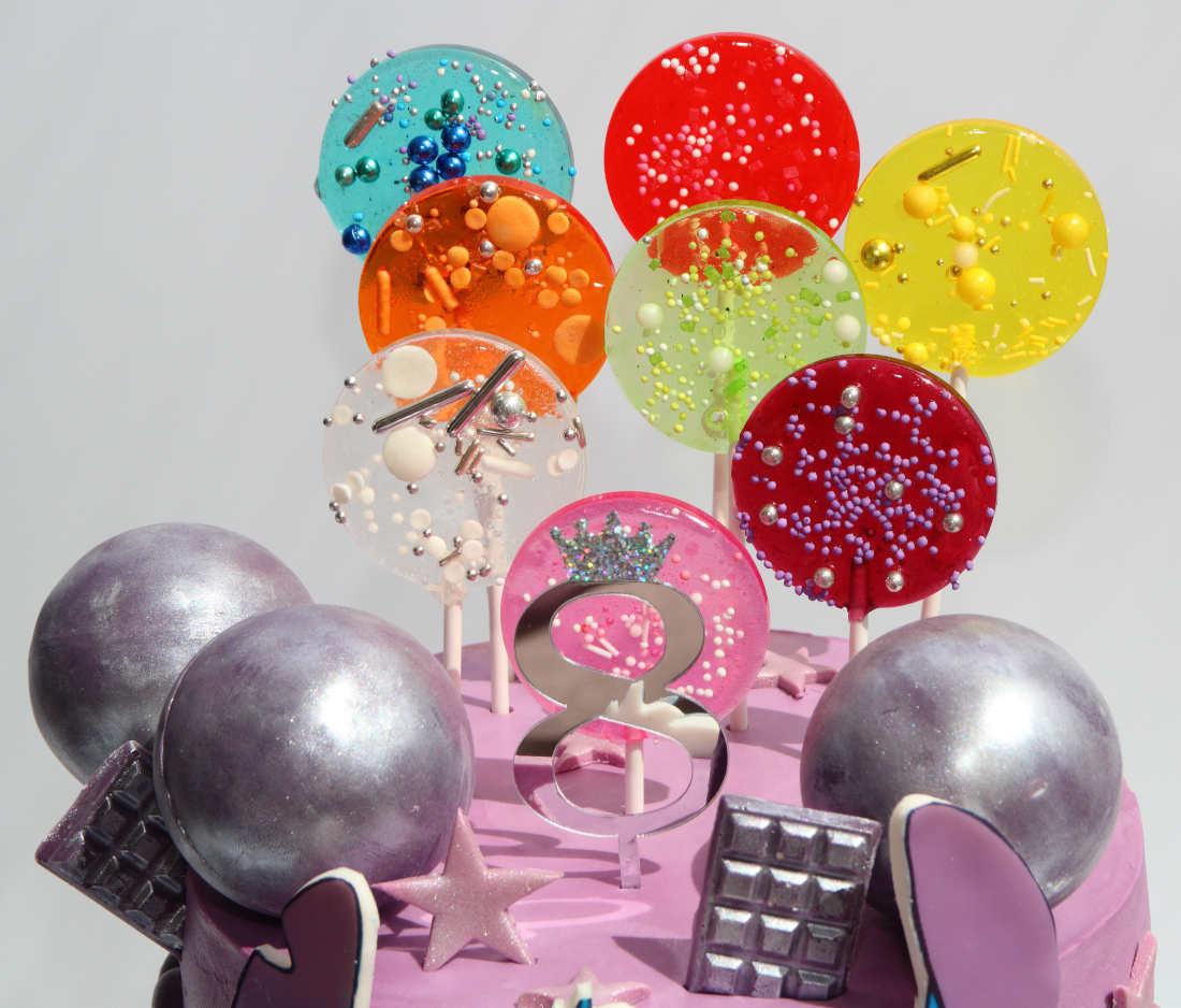 Isomalt lollipops on a cake