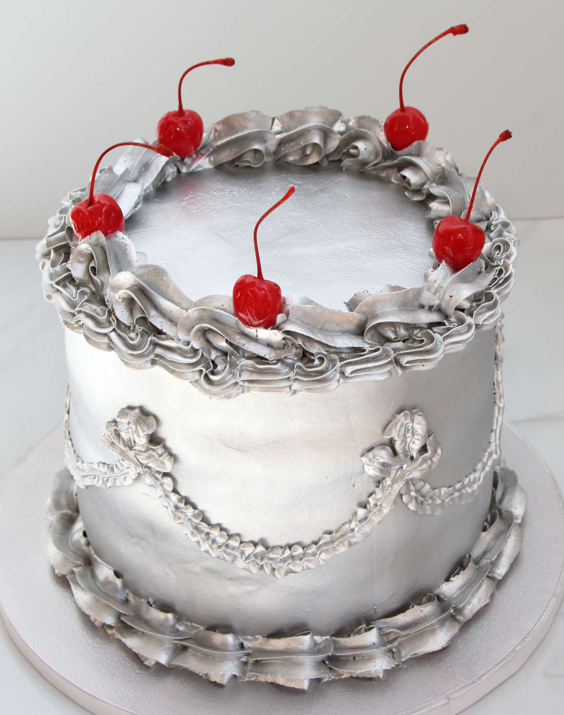 Silver cake with cherries