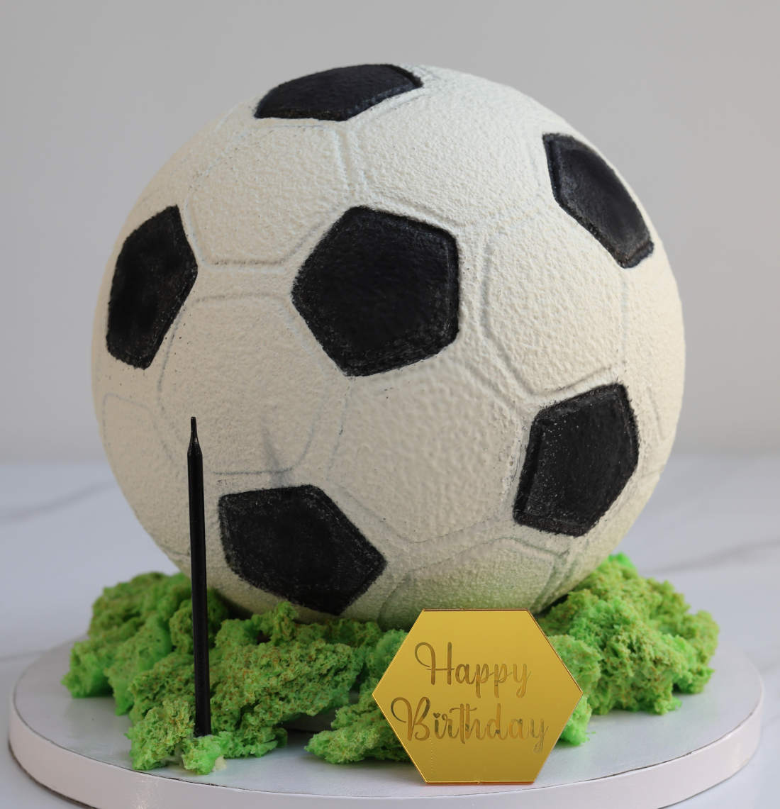 Soccer ball-shaped cake